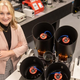 University of Arizona student Grace Halferty stands next to the instrument developed by her team to measure satellite brightness.